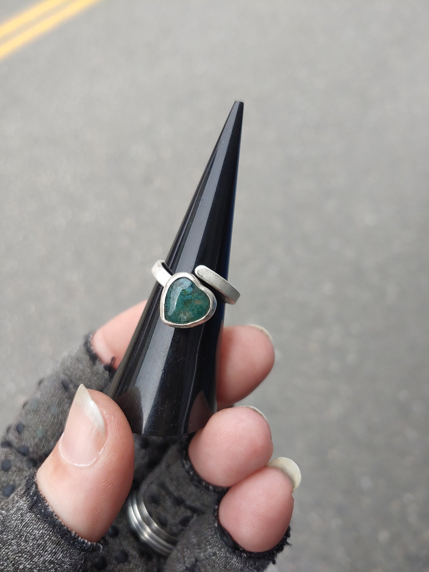 Adjustable sterling silver ring, prong set stone.