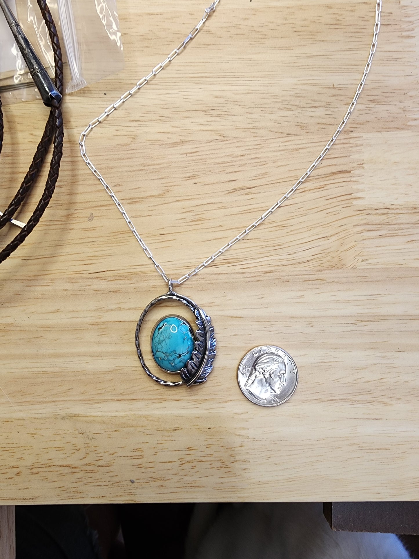 Turquoise feather pendant